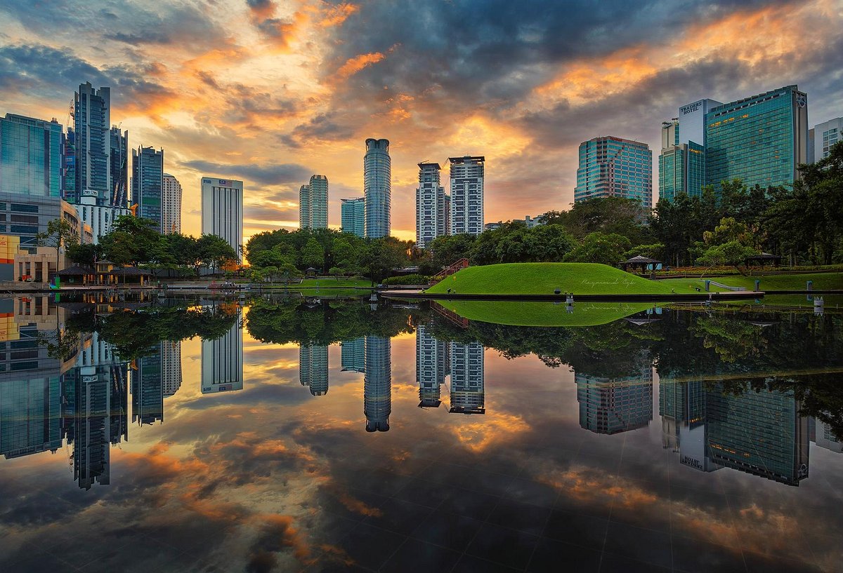 KLCC Park's reflecting pool at golden hour
