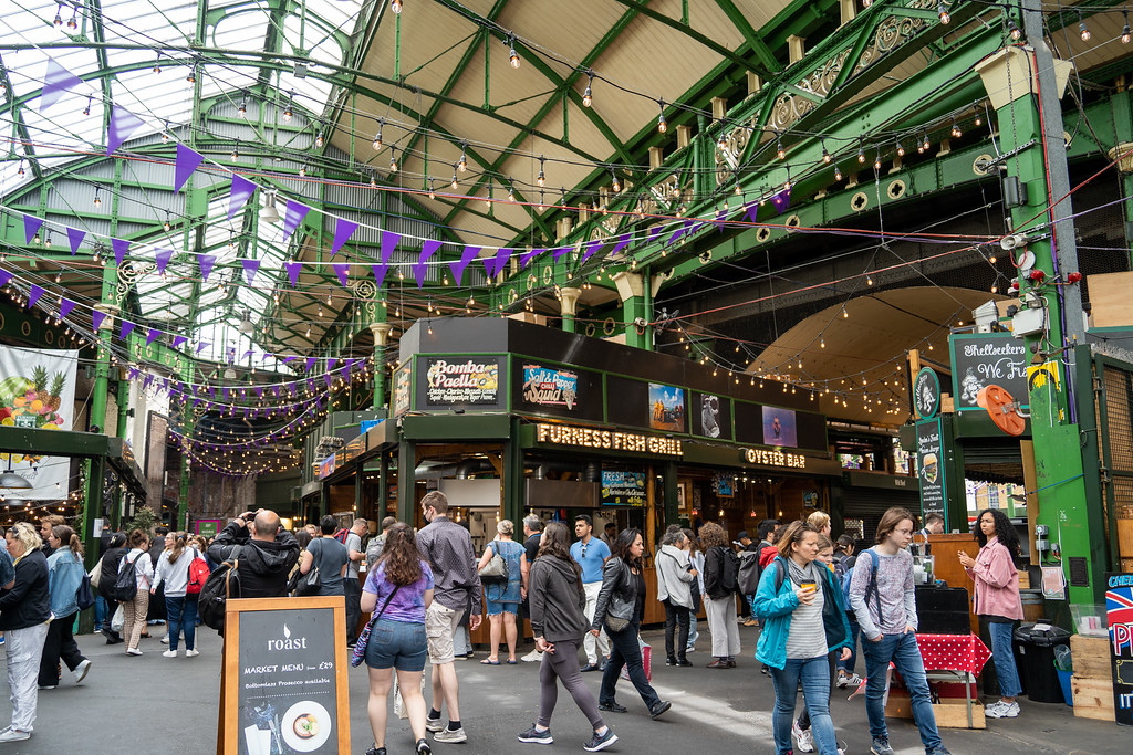 Food stalls under the iron and glass roof of Borough Market